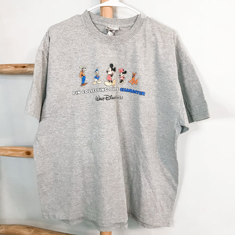Pin Collecting Builds Character | T-Shirt